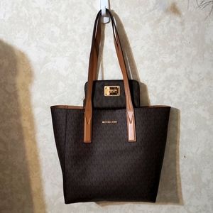 SOLD**SOLD NWOT MK Voyager tote w/matching wallet.
